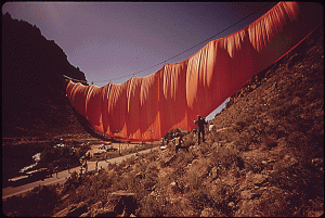 Artist Christo curtain billowing across Rifle Gap
